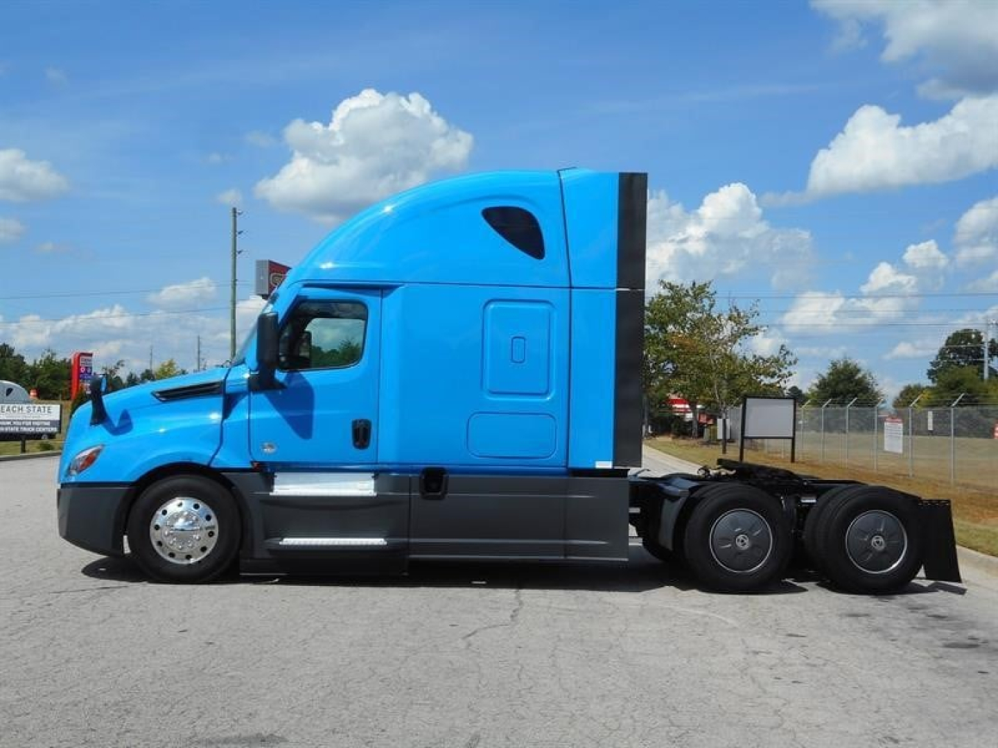 Freightliner Cascadia 126 sleeper tractor in blue side profile view showing cab with silhouette and rear axles.
