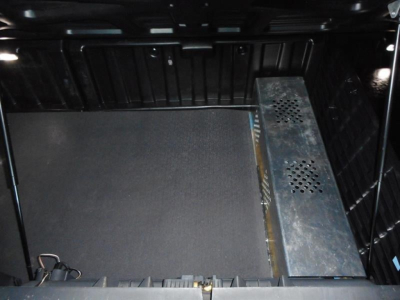 Freightliner Cascadia interior with storage area and metal equipment mount.