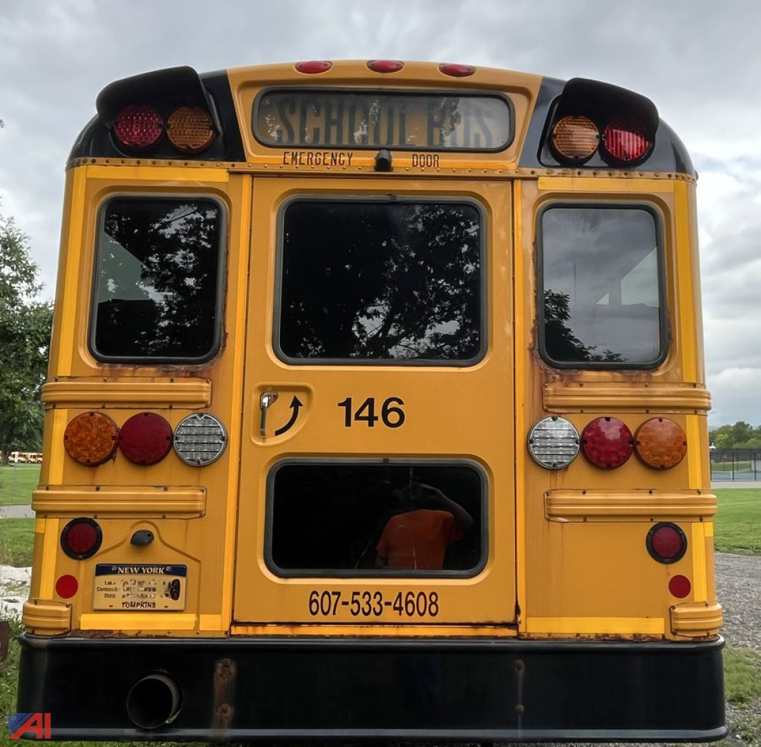 Rear view of a 2018 Thomas CE Series school bus showing the back doors, emergency exit, and contact number with bus ID 146.