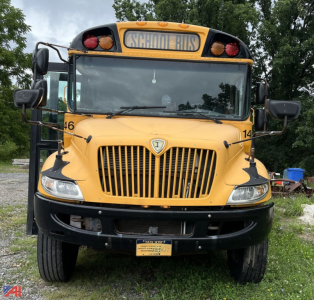 School bus front view 2018 Thomas CE Series, yellow with black bumper, large grille, round amber lights, 'SCHOOL BUS' sign on top, front license plate area visible.