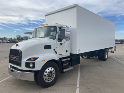 Mack MD6 box truck in a parking lot, white cab with orange clearance lights, large box body. Front grille shows 'MACK' logo; side mirrors; displays no visible text other than branding.