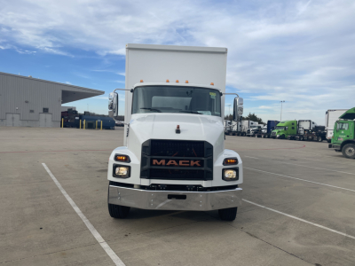 Front view of 2024 Mack MD6 E box truck showing Mack grille, headlights, and cargo box; VIN plate and stock number not visible.