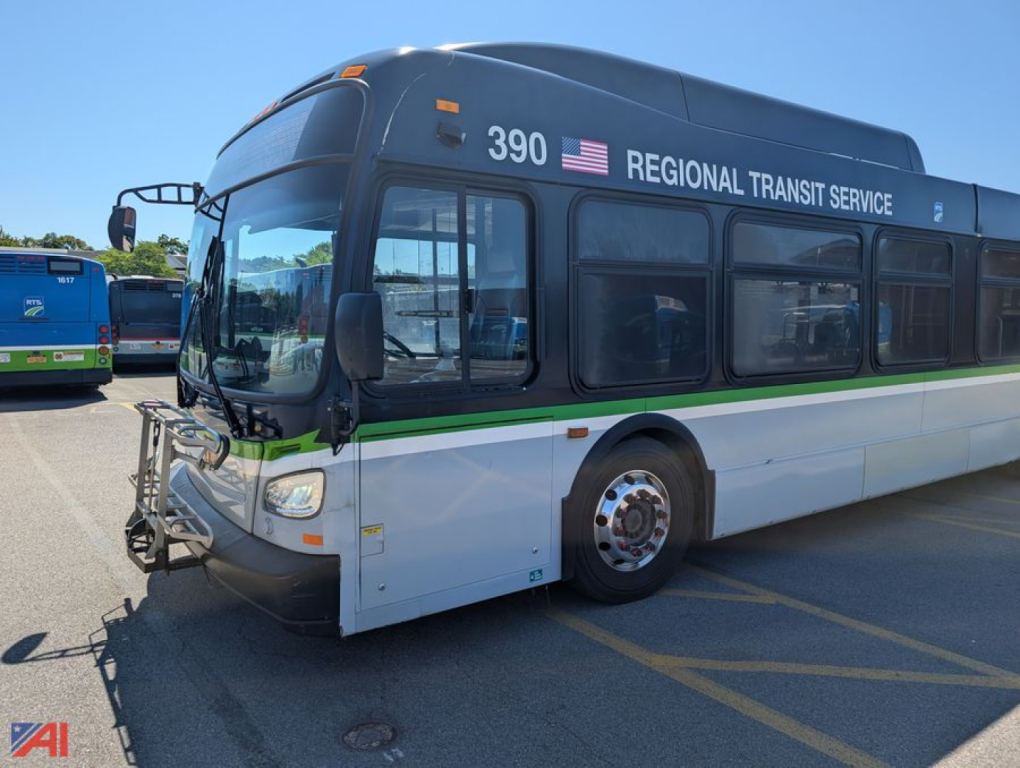 Bus 390 Regional Transit Service XD60 transit bus side view showing front badge and windows.