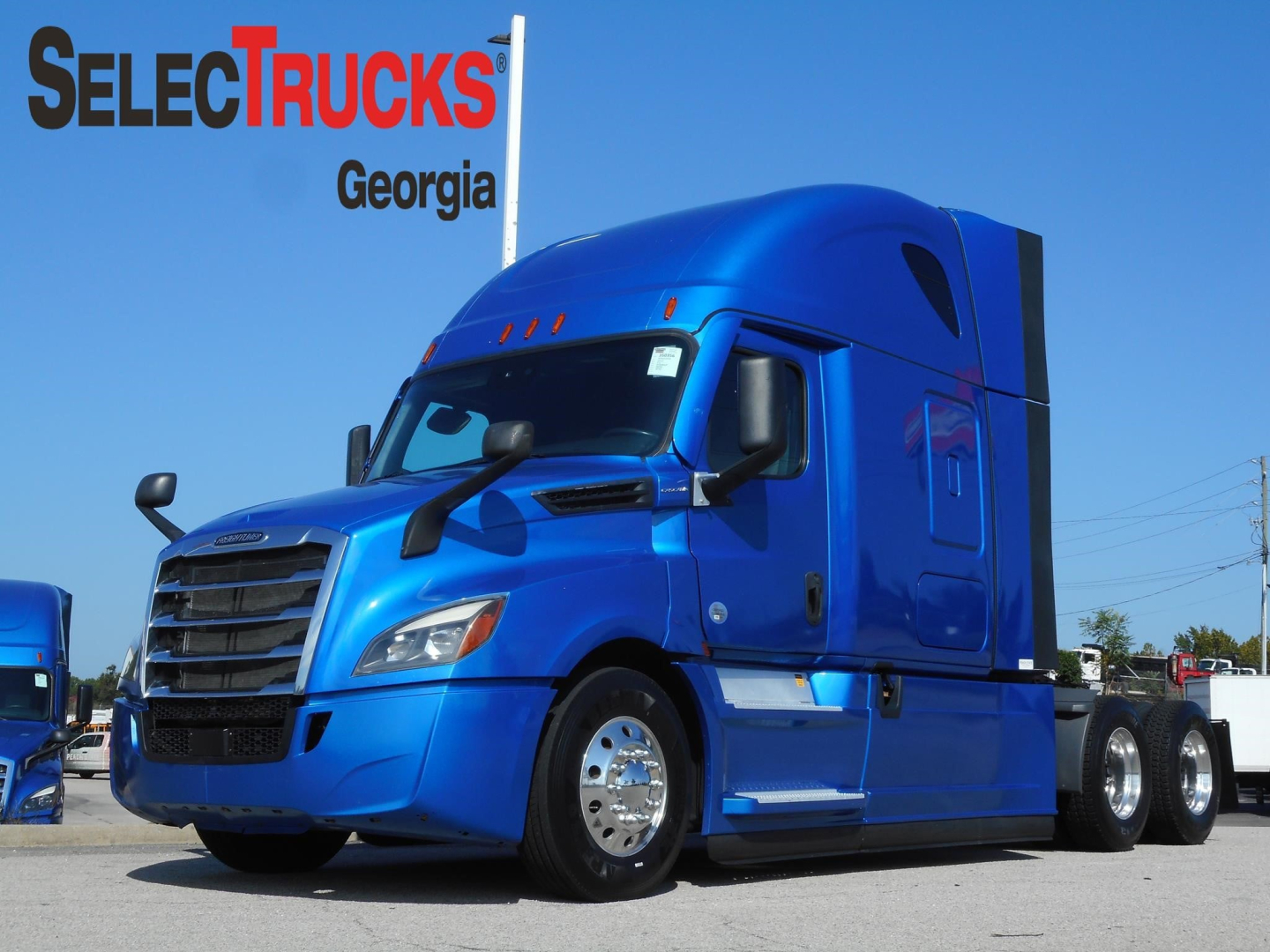Truck image showing a blue 2022 Freightliner Cascadia 126 conventional sleeper tractor from SelectTrucks Georgia with VIN 3AKJHHDR4NSNA2058 and stock 350356.
