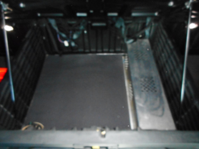 Cab interior of a 2022 Freightliner Cascadia 126 sleeper showing empty floor area in cargo/steps area.