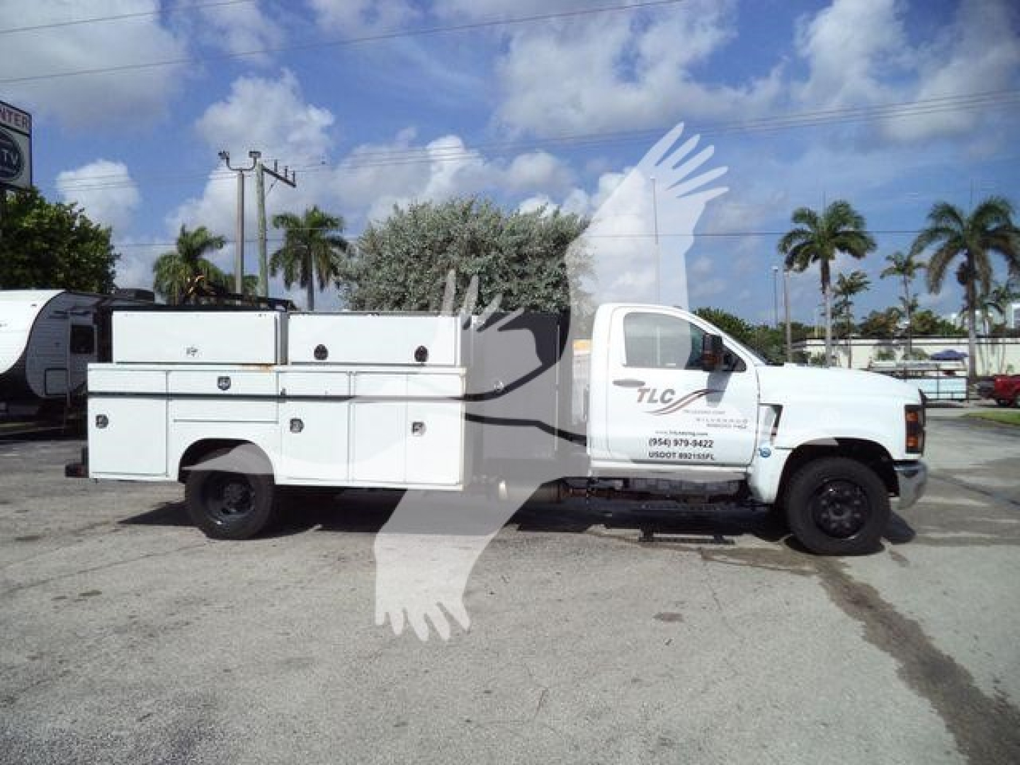 Service/utility truck side view showing utility/service body on a white Chevrolet Silverado 6500HD, stock J05524, VIN 1HTKHPVM1PH705524.