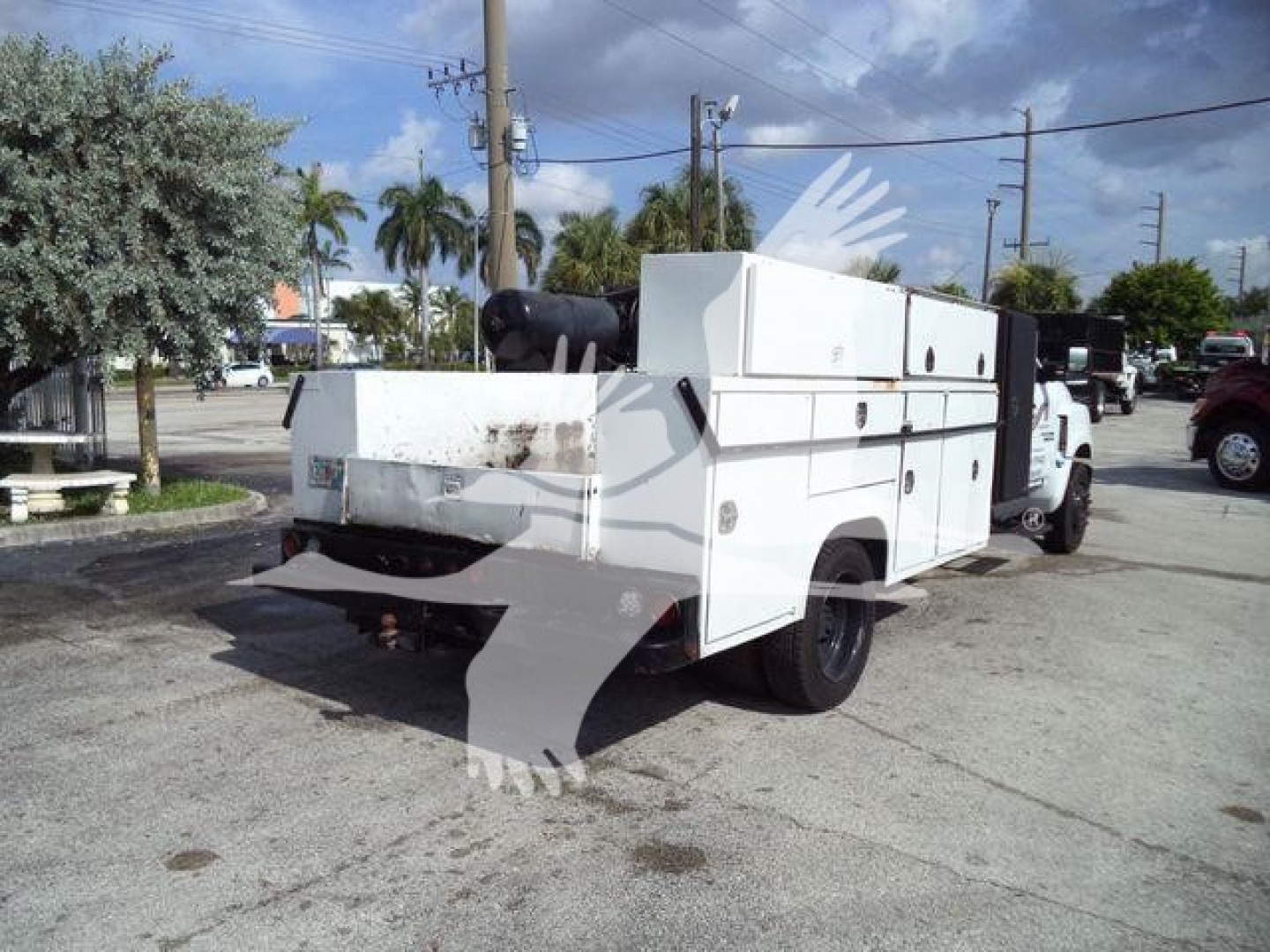Service/utility truck rear and side view showing utility compartments and tool storage on Chevrolet Silverado 6500HD body