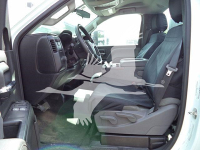 Truck cab interior: front seats, steering wheel, dashboard, and door panels visible in a Chevrolet Silverado 6500HD.