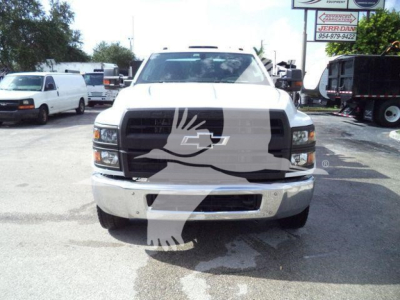 Front view of 2023 Chevrolet Silverado 6500HD service/utility truck with black grille and Chevrolet emblem.