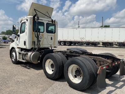 Truck chassis and cab of a 2019 Freightliner Cascadia126 with exposed fifth-wheel area and dual rear axles.