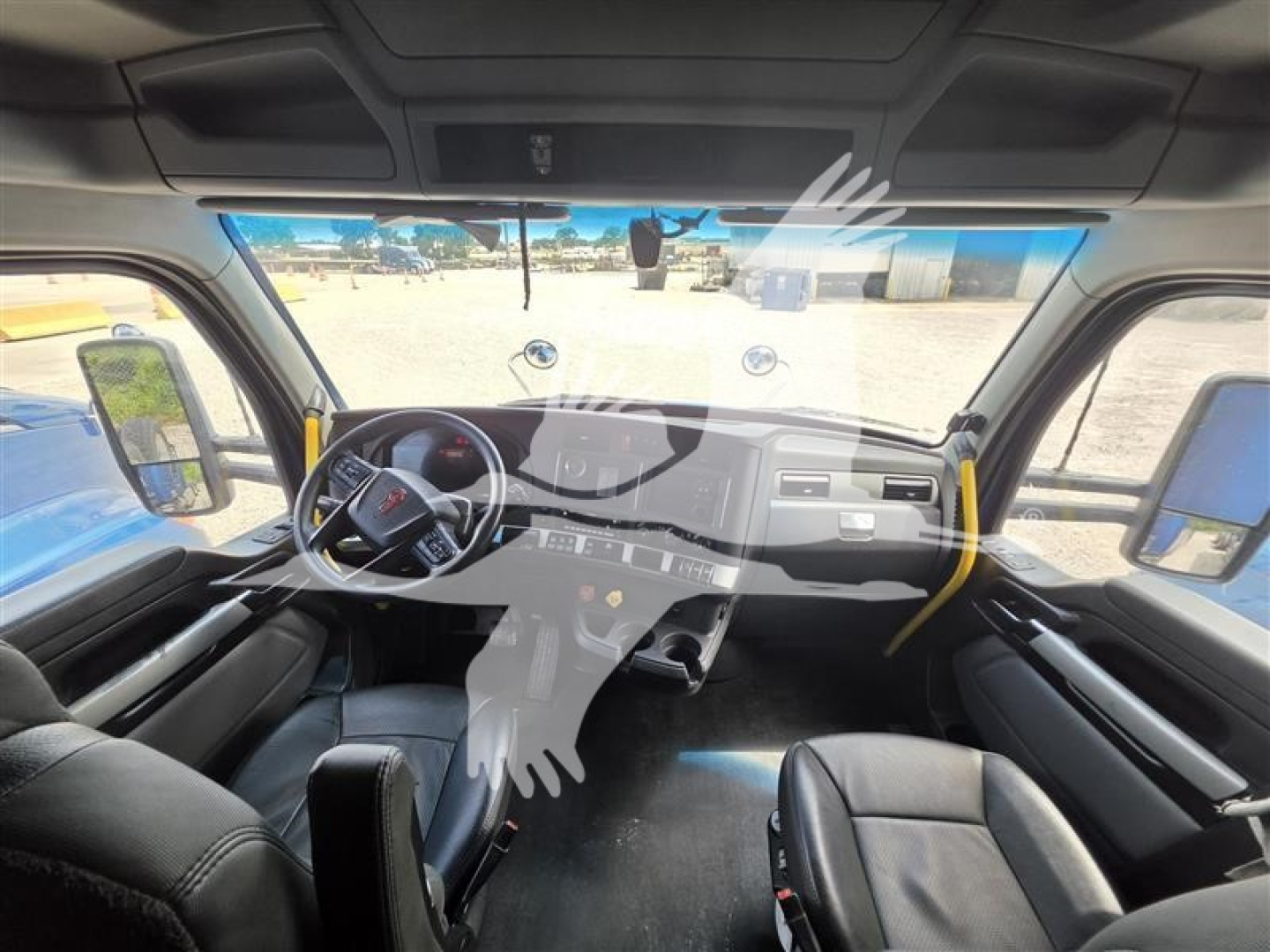 Kenworth T680 truck interior view showing dashboard, steering wheel, and front seats with large windshield and side mirrors.