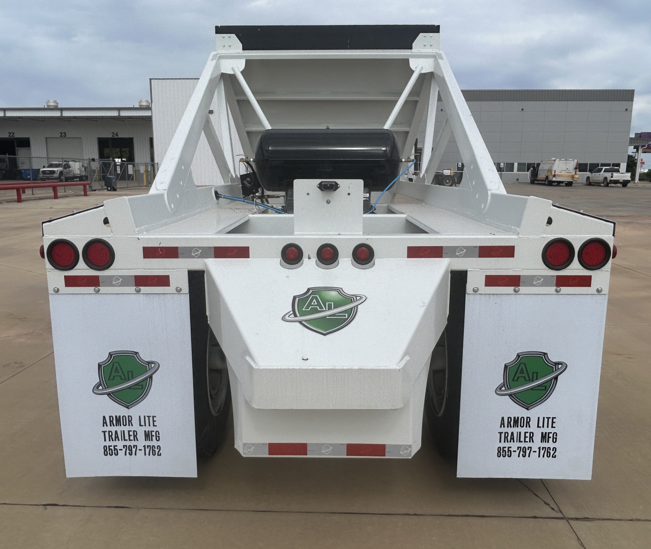 Rear view of Armor Lite SBD40 air dump trailer showing dual fenders with Armor Lite logos, taillights, and frame structure.