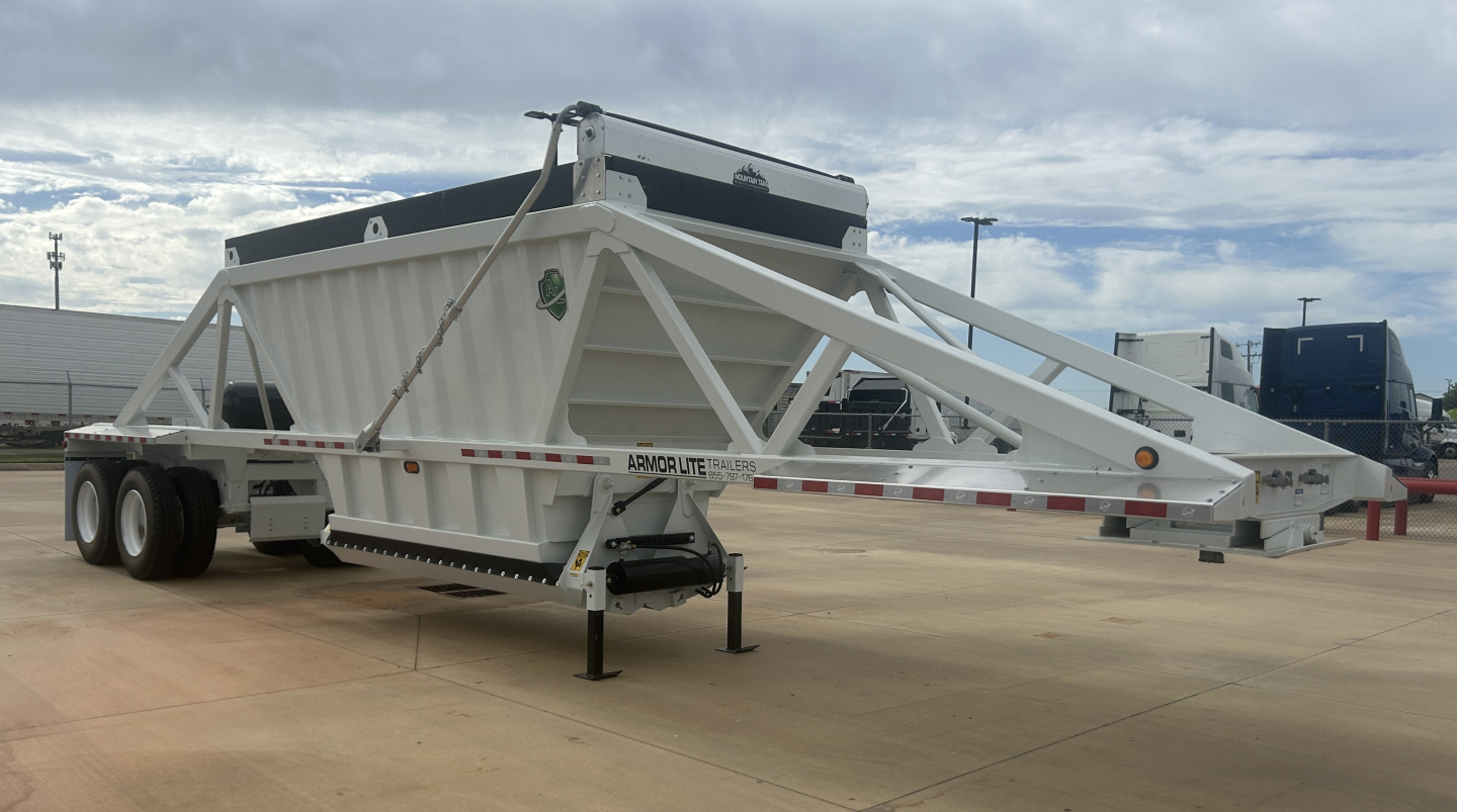 Armor Lite SBD40 air skeleton trailer in light gray with triangular frame and dual axle, front hitch and jack stand visible.