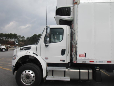 Freightliner M2 106 Plus cab and refrigerated box side view showing cab, front wheel, and diesel fuel tank with steps.