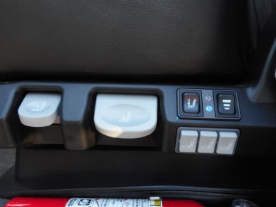 Seat adjustment controls and seating adjustment buttons in a truck cabin showing ergonomic switches.
