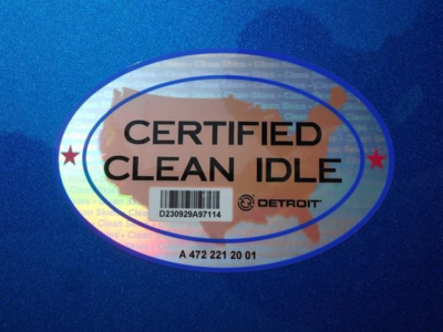 Oval sticker reading CERTIFIED CLEAN IDLE with Detroit logo on a blue surface.