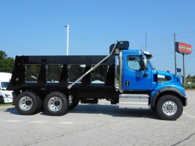 Dump truck with blue cab and black dump body, side view showing wheel configuration and hydraulic hoist.