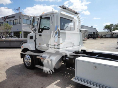 MD6 rollback truck cab in-view with chrome wheels and utility compartments, showing side profile and roll-back chassis.