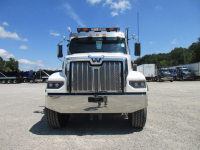 Western Star 49X dump truck front view showing large chrome grille, headlights, bumper, and emblem.