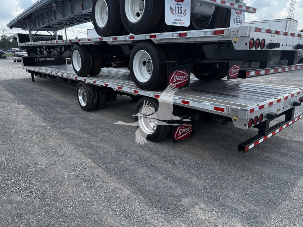 Flatbed trailer stack showing multiple decks and tires with Dorsey logo on red mud flaps and metal checker plates.