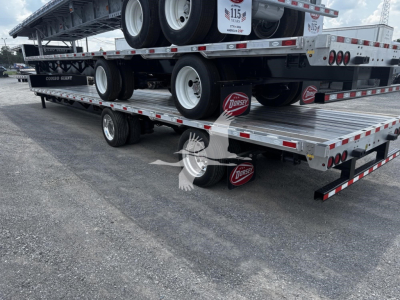 Flatbed trailer stack showing multiple decks and tires with Dorsey logo on red mud flaps and metal checker plates.