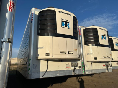 Thermo King trailer reefer unit on a white refrigerated trailer with Twin refrigeration units, Thermo King logo visible.