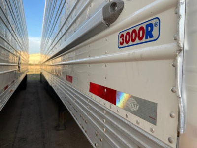 Trailer side with 3000R logo and reflective strip, utility reefer body in view