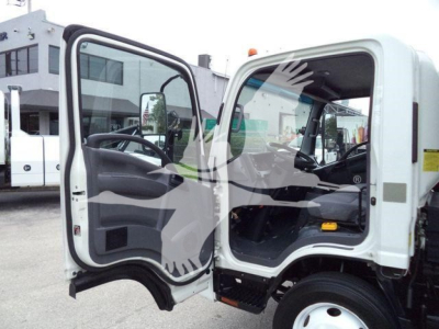 Isuzu NPR-HD cab interior with driver door open showing steering wheel dashboard and entry area.