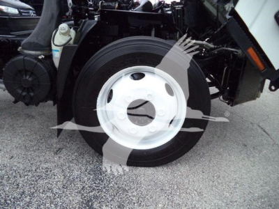 Isuzu NPR HD truck front wheel and suspension components visible in service-ready condition.