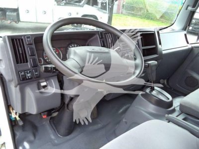 Isuzu NPR HD interior showing steering wheel and dashboard view.