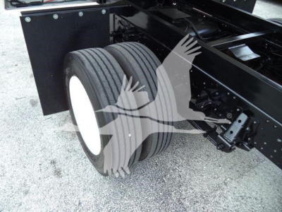 Isuzu NPR HD truck rear dual rear wheel setup showing suspension and chassis components.