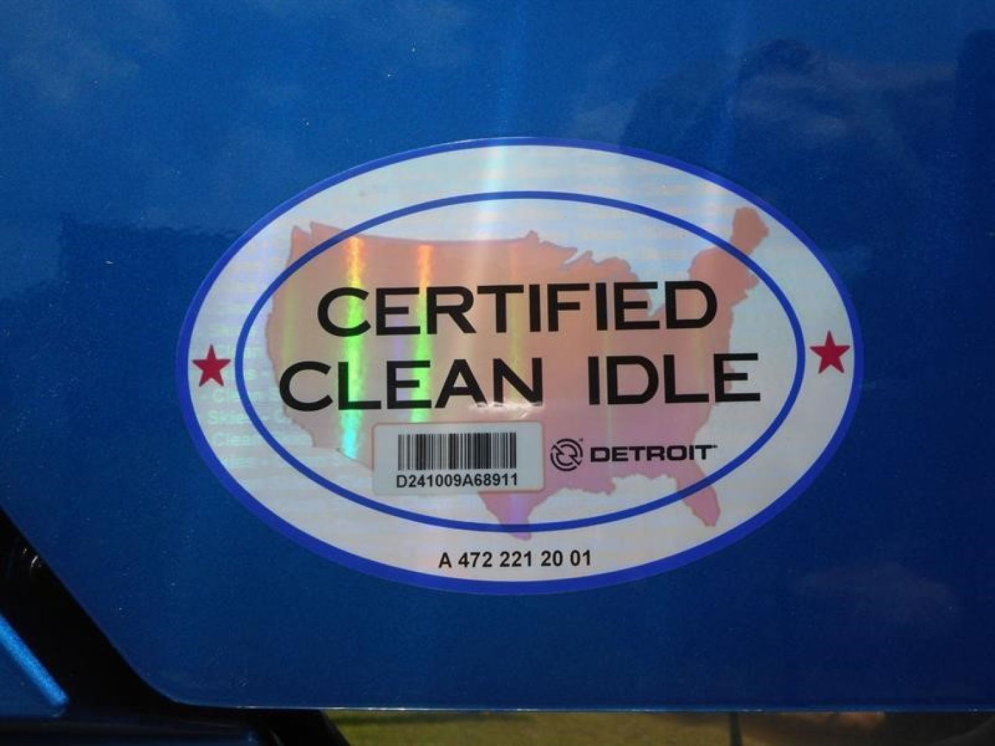 Sticker reading CERTIFIED CLEAN IDLE on a blue surface of a 2027 Western Star 47X.