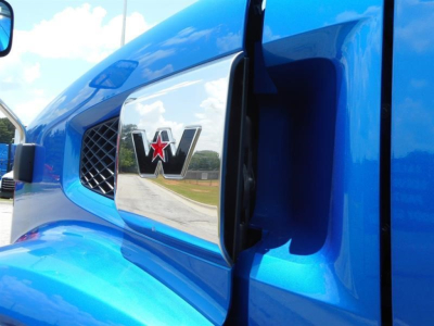 Blue Western Star truck hood with chrome emblem and star logo visible
