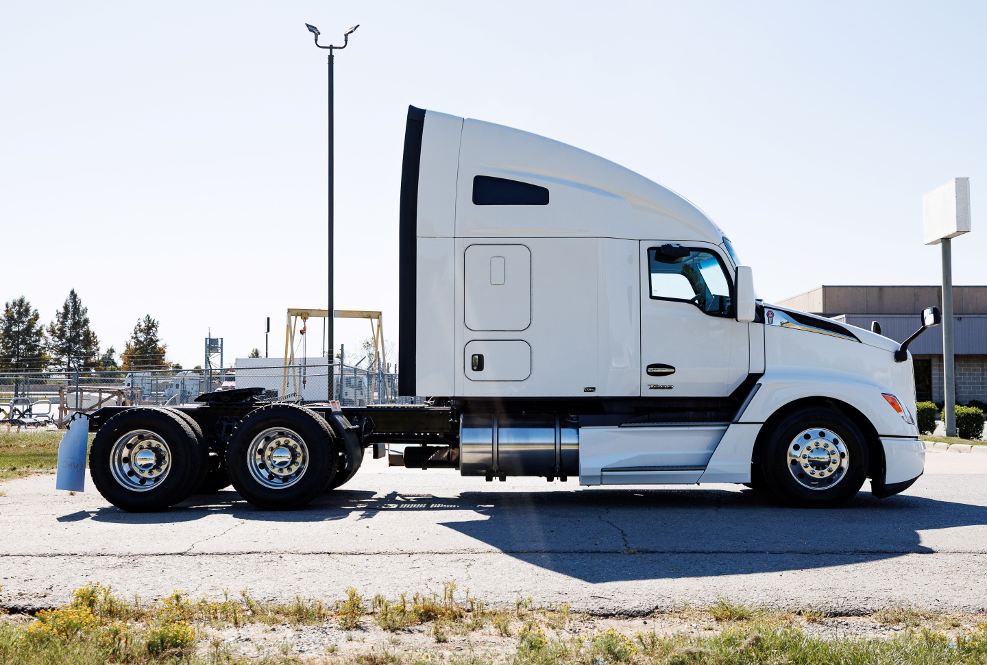 Kenworth T680 truck in profile view showing sleeper cab and dual rear axles.