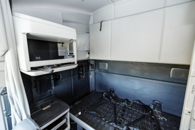 Kenworth T680 sleeper cab interior showing cargo area and storage compartments