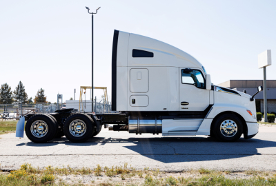 Kenworth T680 truck in profile view showing sleeper cab and dual rear axles.