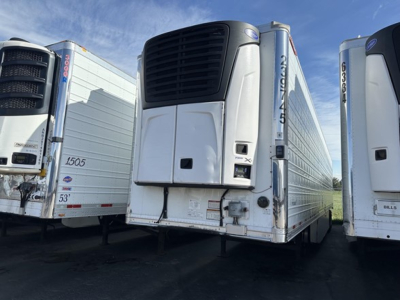Great Dane air ride reefer trailer with black cooling unit and white insulated body, adjacent trailers in yard, stock number UE11683 visible.