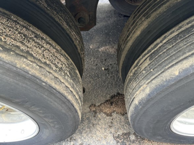 Great Dane air ride reefer trailer wheels and gap between dual tires with dirt and wear visible.