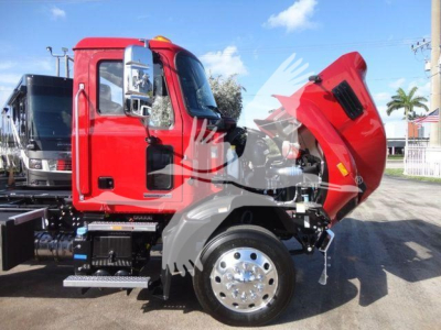 Mack MD6 truck in front profile view with hood open, showing front wheel and engine bay area.