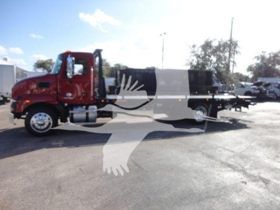 Truck cab and rollback equipment on a red Mack MD6 chassis with a long flatbed and integrated rollback bed.
