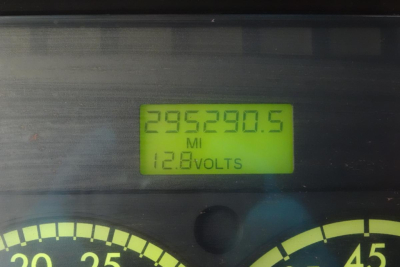 Dashboard display showing mileage 295,290.5 MI and 12.8 VOLTS.