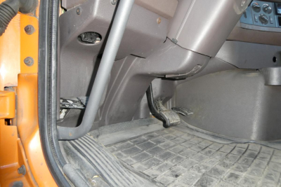 Volvo VNM64T truck interior front cab floor and pedals visible.