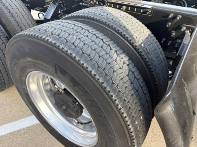 Dual rear wheels (dual tires) on a Volvo VNR tractor chassis, showing the wheel rims and tire treads.