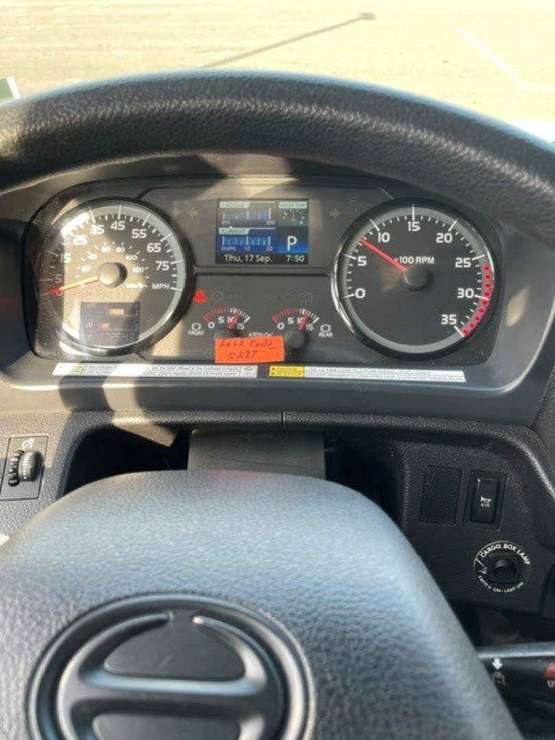 Dashboard of a 2017 Hino 268 showing instrument cluster with speedometer, tachometer, digital display, and steering wheel.