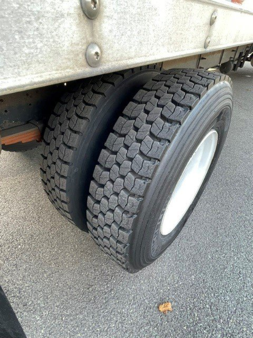Dual rear wheels of a 2017 Hino 268 truck showing off-road style tires and wheel rims.