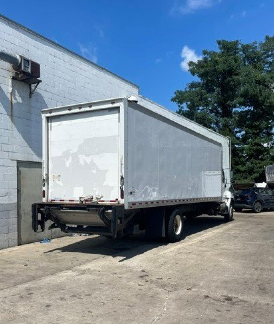 Hino 268 box truck rear/right side view showing cargo box and underrun protective bar.