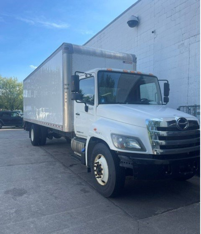 Vehicle image showing a white 2017 Hino 268 box truck with a large cargo box, front grille, and side mirrors.
