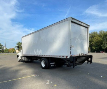 Box truck showing rear and side view of 2017 Hino 268 with a large silver cargo box and white cab, used vehicle.