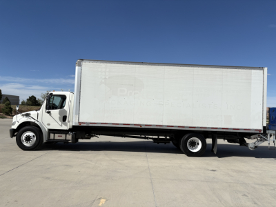 Freightliner M2-106 box truck side view showing white cab and long rectangular cargo area.