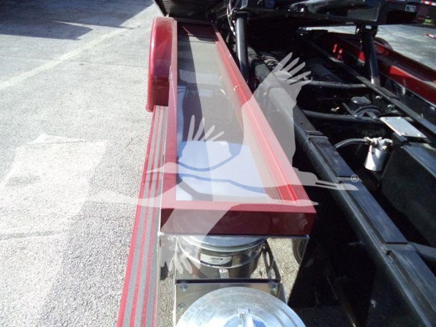 Kenworth T280 rollback truck chassis with hydraulic winch area and storage compartment visible.